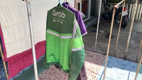 Green Grab Jacket Uniform Hang Dry On Clothes Line After Cleaned, Washed At Home Stock Footage 247458977
