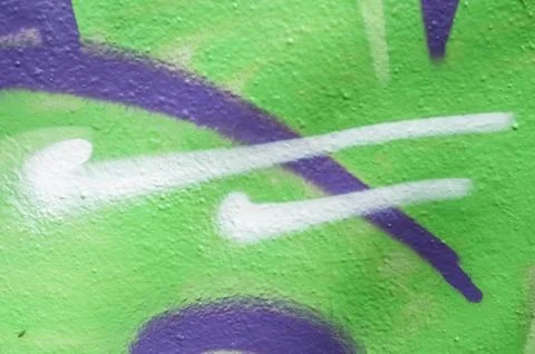 Green graffiti on the wall texture Stock Photos
