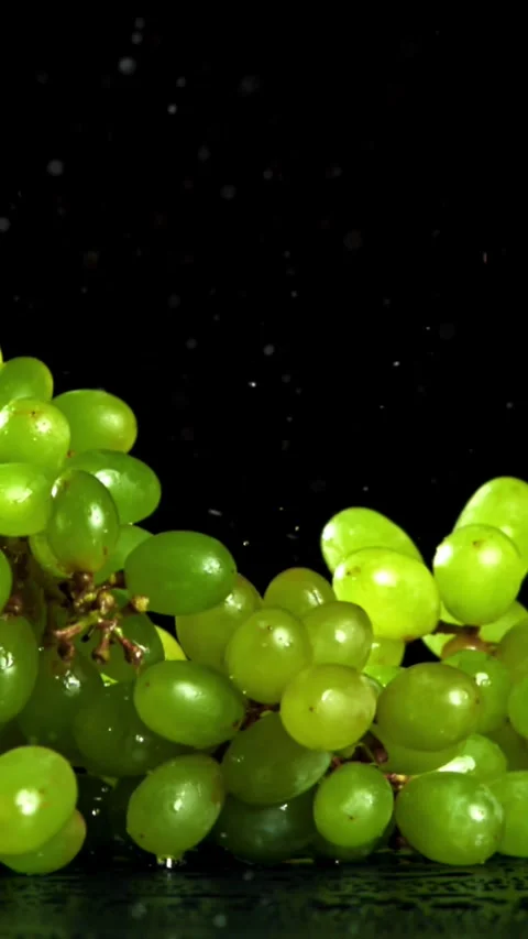 Green grapes fall on the table. Filmed on a high-speed camera at 1000 fps Stock Footage 335380229