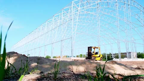 Green Grass and Blue Sky with Structural Framing Stock Footage 326034408