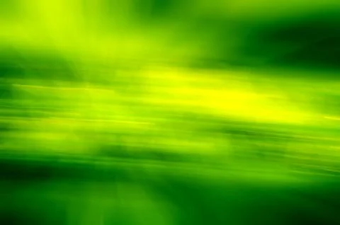 Green grass blur spring texture, light and dark lines. Stock Photos