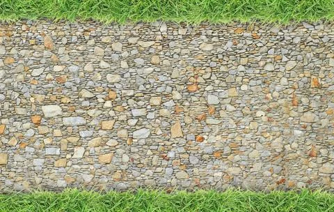 Green grass frame on stone wall background Stock Photos