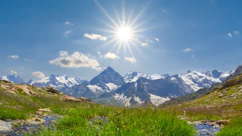 Green grass in a mountain valley time lapse scene Stock Footage 169244777