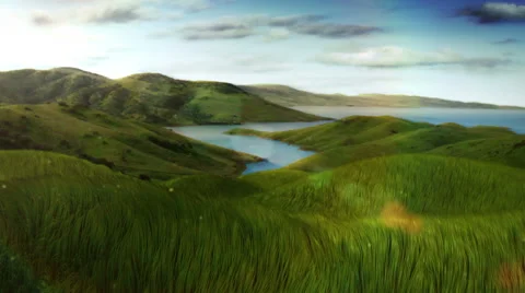 Green grass over cloudy timelapsed sky. A lake and mountains. Loopable. Video stock 54837188