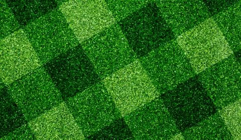 Green grass texture with intersecting patches of light and dark green 写真素材