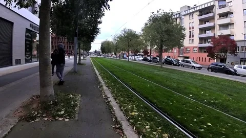 Green grass on tramway route north, Avenue de Grande Bretagne to La Cartoucherie Vídeo Stock 308608974
