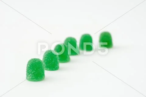 Green gum drops in a line Stock Photos