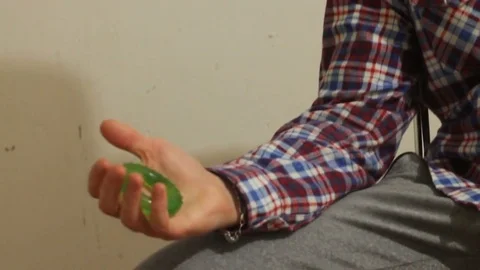 Green Hand expander in the hand of a man Stock Footage 69748057
