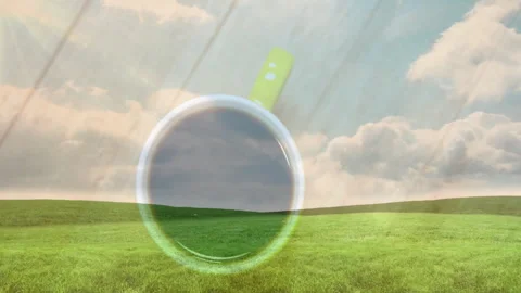 Green-handled ceramic coffee cup floating above lush green meadow, hills under Stock Footage 307445950