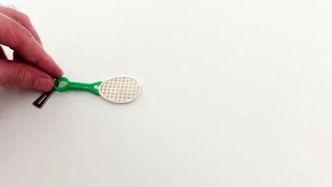 Green-Handled Mini Racket Keychain- Product Detail View Video stock 318948533