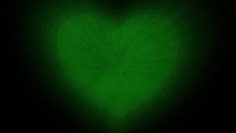 Green heart made of small particles on a black background. Stock Footage 262661812