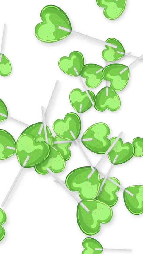 Green Heart Shaped Lollipops Falling Against a White Background Stock Footage 344848669