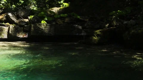 Green hidden magic waterfall in the middle of forest Stock Footage 112026387