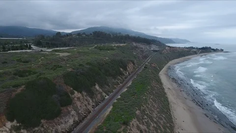 Green hill on the beach, train tracks Video stock 98474495