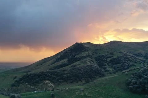 Green Hill with Rim Light at Dramatic Sunset, Xinjiang China Stock Photos