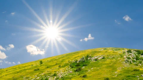 Green hill under a sparkle sun, natural prairie scene Stock Footage 345670453