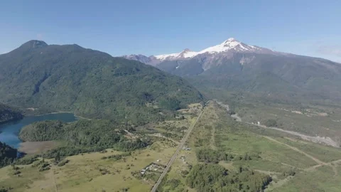 Green Hills and Lakes Seen From Drone Above Mountainous Terrain Stock Footage 312842453