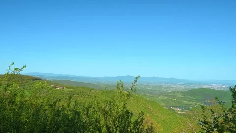 Green hills roll under clear blue skies. Balkan, Eastern Europe, POV Stock-Footage 333844353
