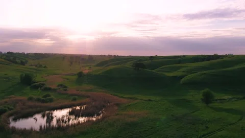 Green hills at sunset Video stock 255178108