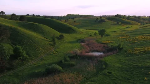 Green hills at sunset Video stock 255178891