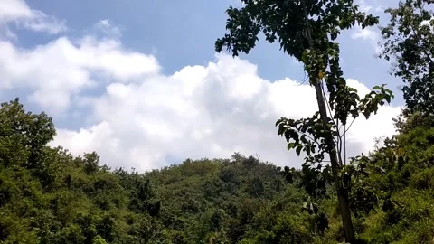 Green Hills Under Cloudy Sky Stock Footage 328061821