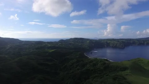 GREEN HILLS WITH VIEW OF A COVE Stock Footage 130866044