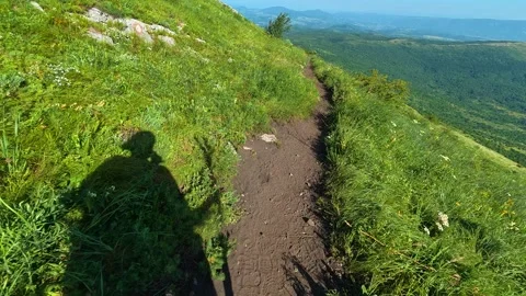 Green hillside with winding path through tall grass. Mount Rtanj, Serbia Видео 342315026