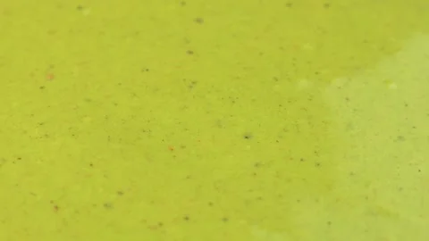 Green homemade pistachio paste texture circle rotation close up Stock Footage 295052896
