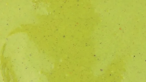 Green homemade pistachio paste texture circle rotation Stock Footage 311797970