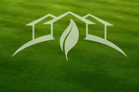 Green House with Leaf Ghosted Over Fresh Cut Grass. Stock Photos