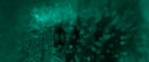Green ice cube rotate on dark background macro shot Stock Footage 106007470