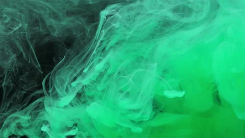 Green ink acrylic paint mixing in water, swirling softly underwater in aquarium Stock Footage 155770053