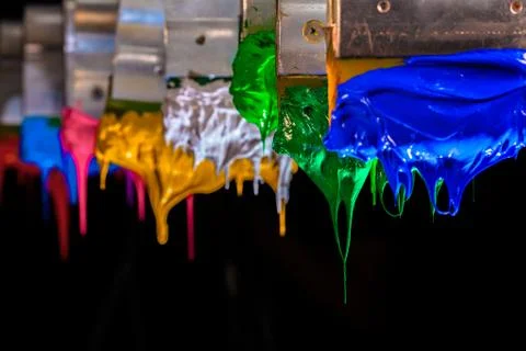Green ink drop down from print handle. Stock Photos