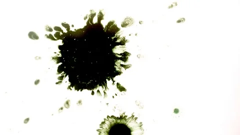 Green ink drops splatters spilling on white background Stock Footage 125476059