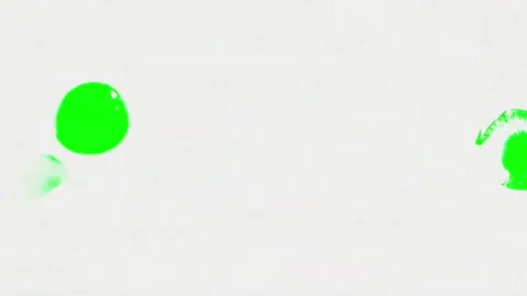 Green Ink Splattering and Bleeding on White Texture Paper Loop Video stock 335633788