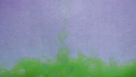 Green ink in water creating abstract shapes and form Stock Footage 89651903