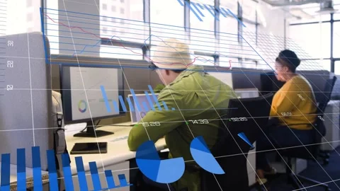 Green-jacket worker leaning and typing at desk, camera panning showing AR charts Stock Footage 333301420