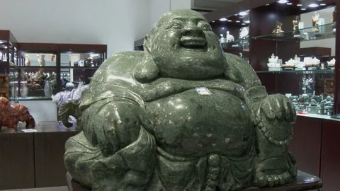 Green jade Chinese Buddha in upscale shop, 4K. Stock Footage 79706366