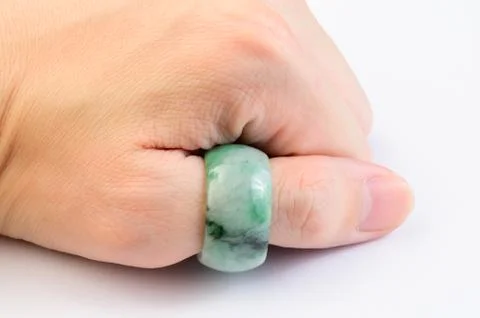 Green jadeite ring on hand Stock Photos