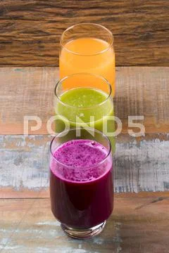 Green juice: orange, cabbage, mint, ginger. Orange juice with carrot. Beet juice Stock Photos
