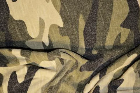 Green khaki textile pattern as a background. Green material texture on fabric Stock Photos