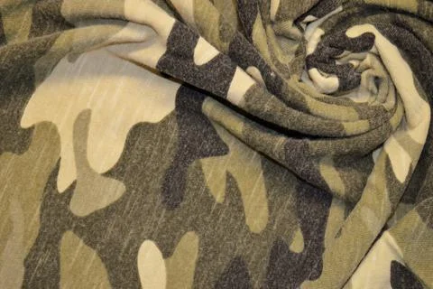 Green khaki textile pattern as a background. Green material texture on fabric Stock Photos