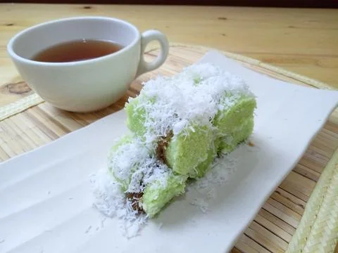 Green Klepon and a cup of tea, Steamed Indonesia Traditional Cake, made from  Stock Photos