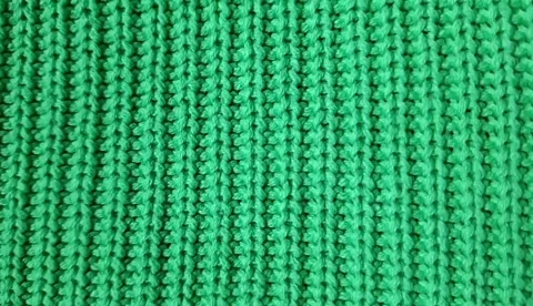 Green knitted fabric as background, top view. Close-up.  Series. Video stock 346492332