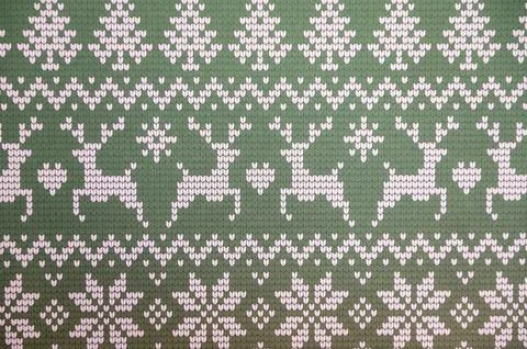 Green knitted pattern with reindeer and snowflakes in nordic style Stock Photos