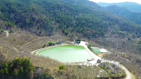 A Green Lake on the top of a Mountain Stock Footage 247958438