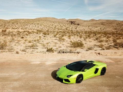 Green Lamborghini Supercar in desert Stock Photos