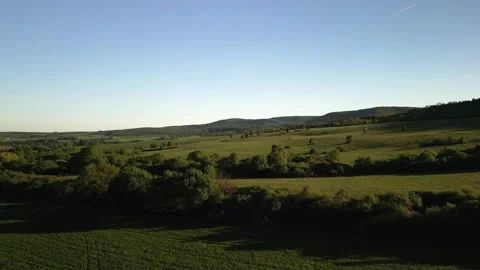 Green Landscape with Fields and Distant Hills Stock Footage 307932394