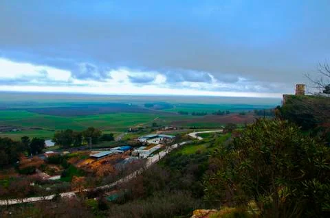 Green lanscape view, big fields and small village Stock Photos