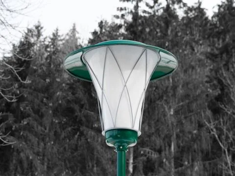Green lantern in front of a forest Stock Photos